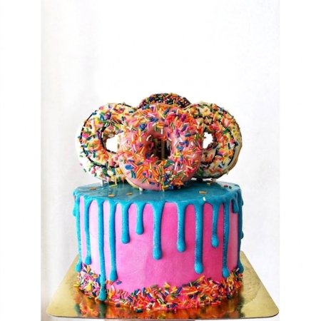 Pink cake with blue drip donuts