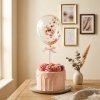 Torta rosa con globo de confeti