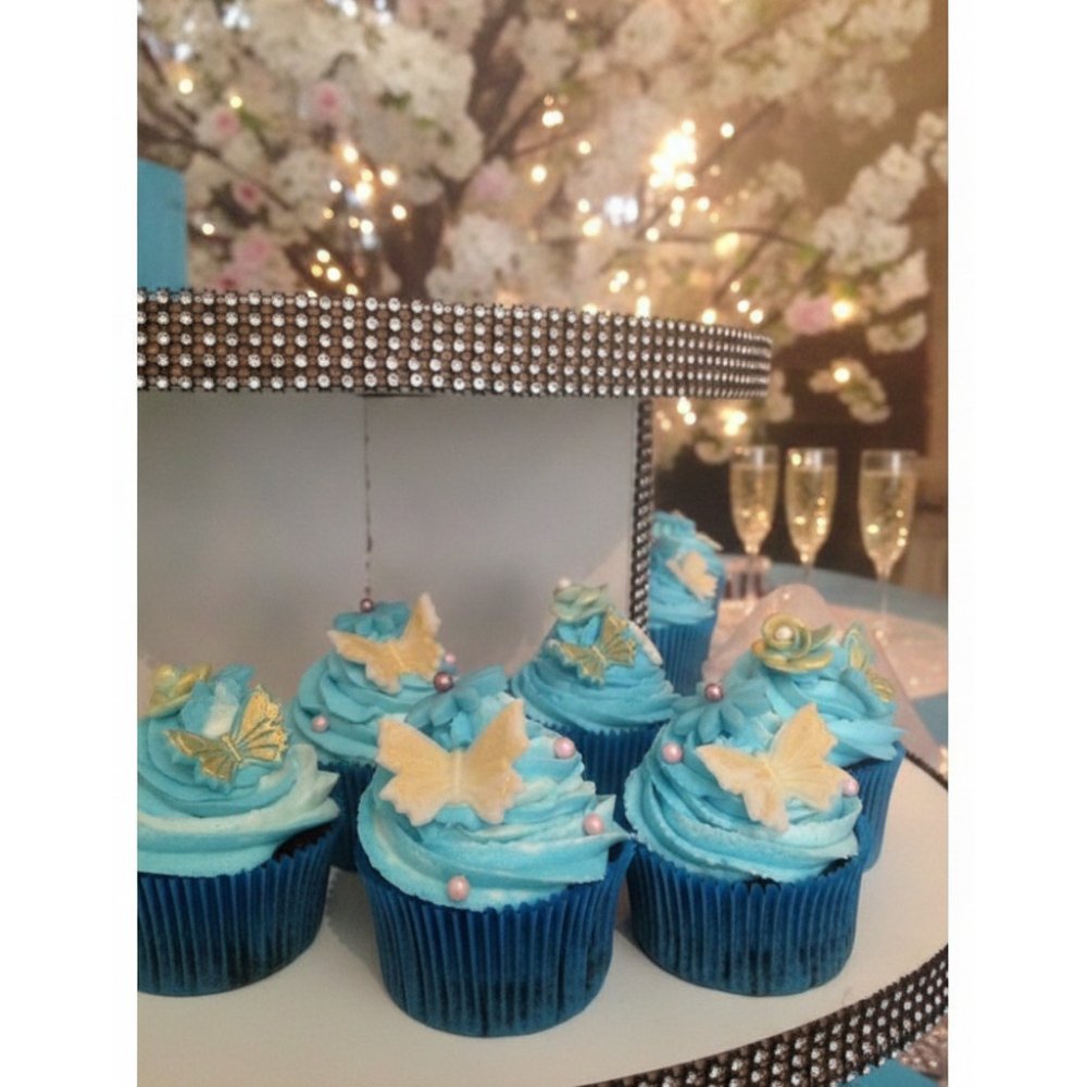 Magdalenas gourmet decoradas con mariposas azules