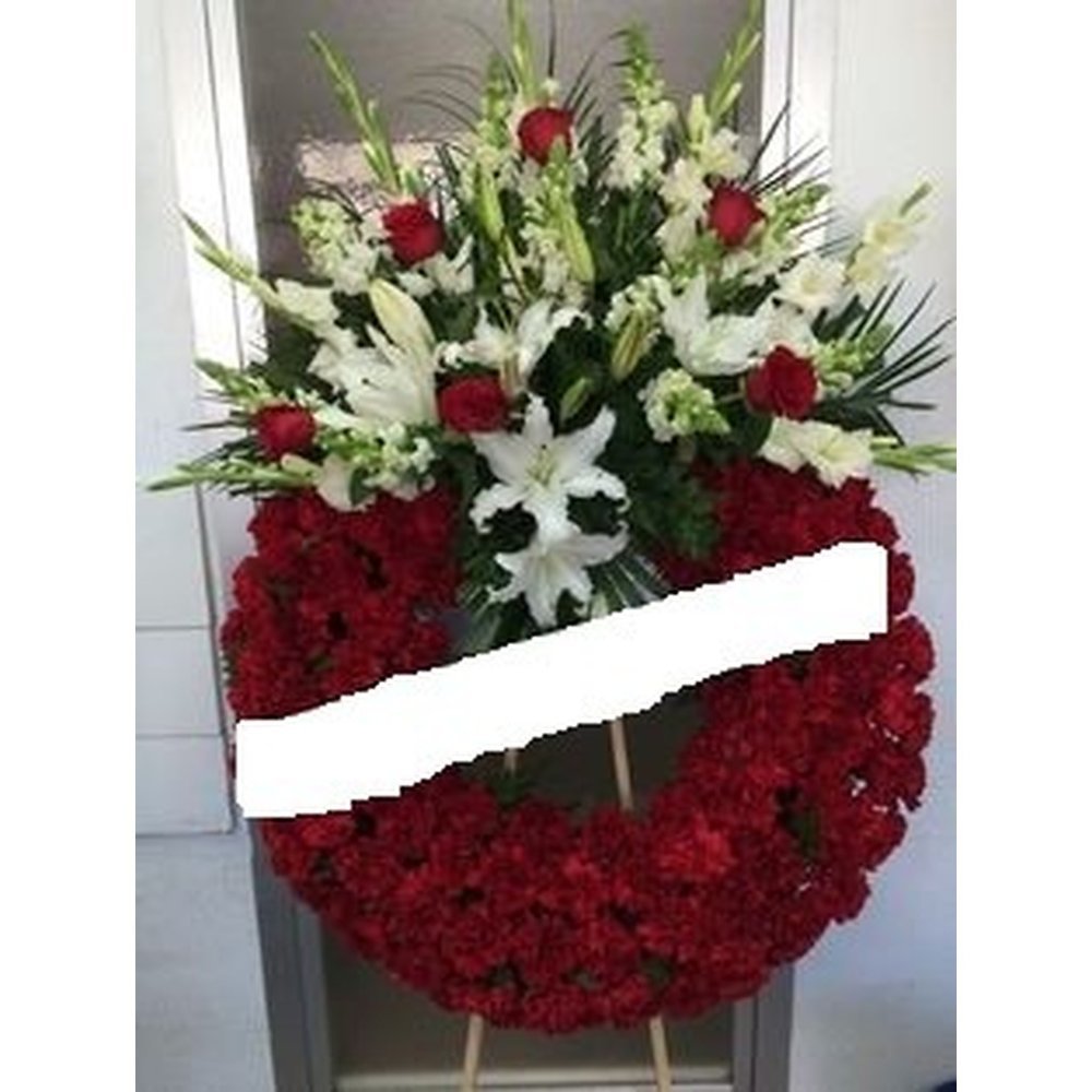Corona de flors vermella amb esprai de lliri blanc