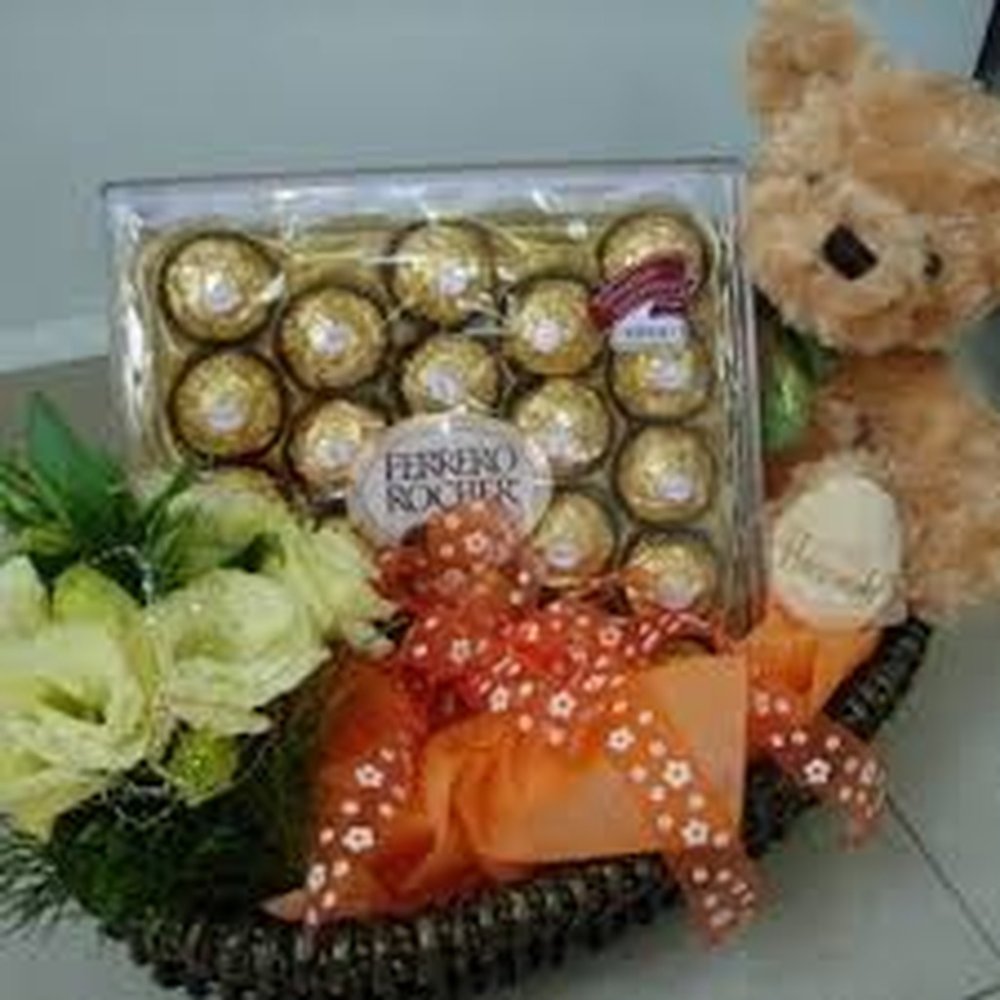 Chocolate, lilies, and teddy bear gift