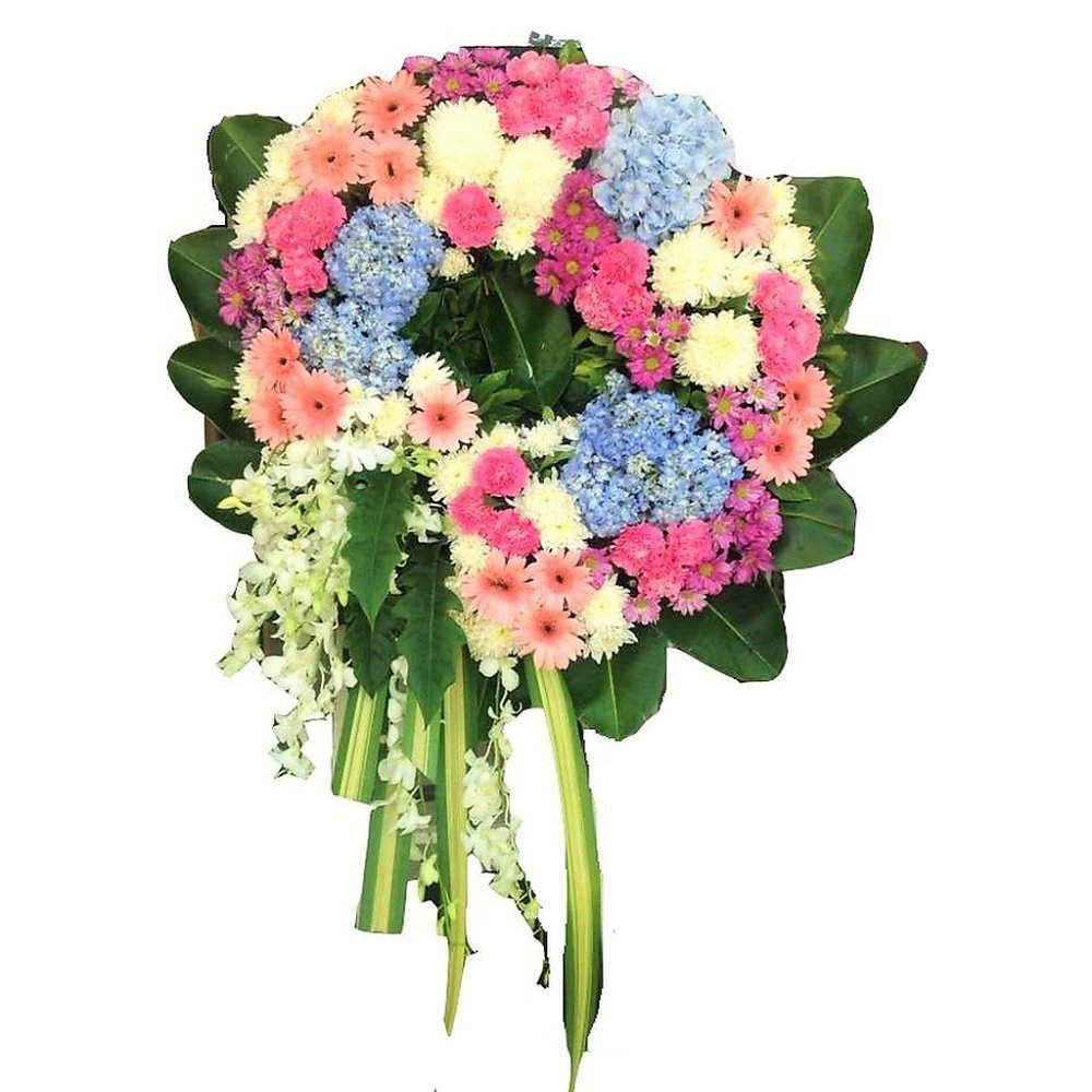 Pastel pink and blue funeral spray