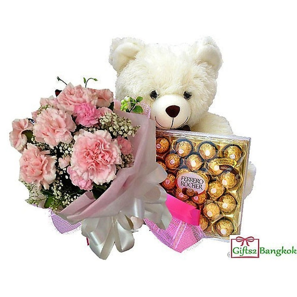 Œillet rose, ours en peluche, chocolats