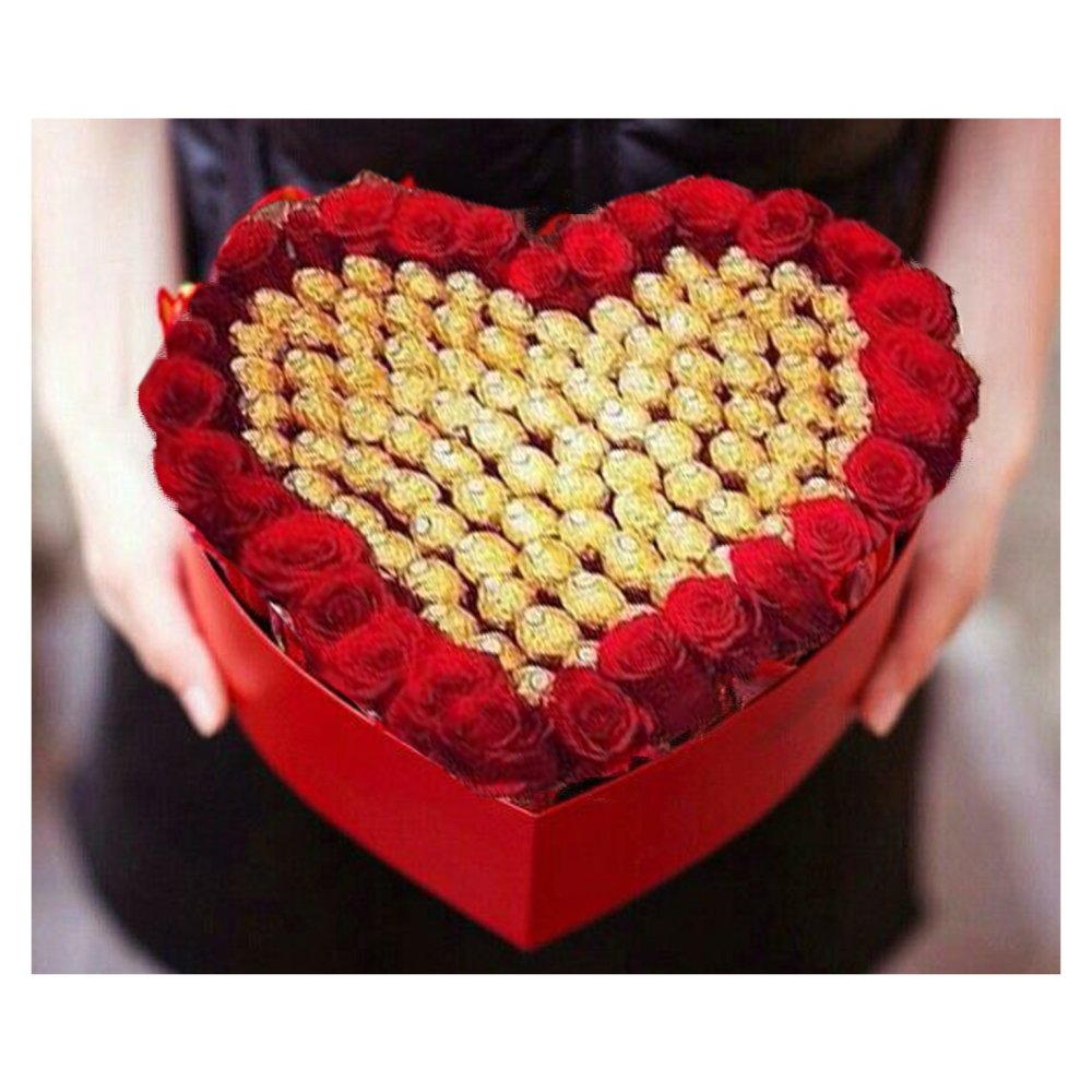 Scatola a forma di cuore con rose rosse e cioccolatini dorati
