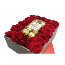 red roses in box with chocolate