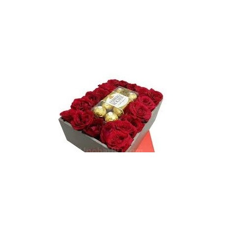 red roses in box with chocolate