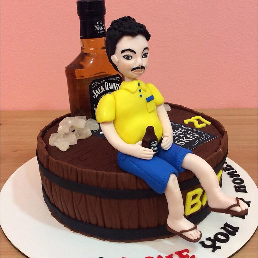 Whiskey barrel cake with figurine