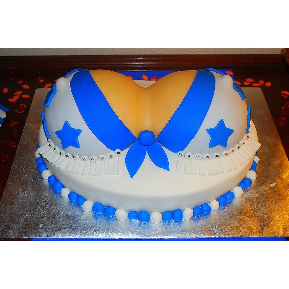 Sculpted female chest themed cake