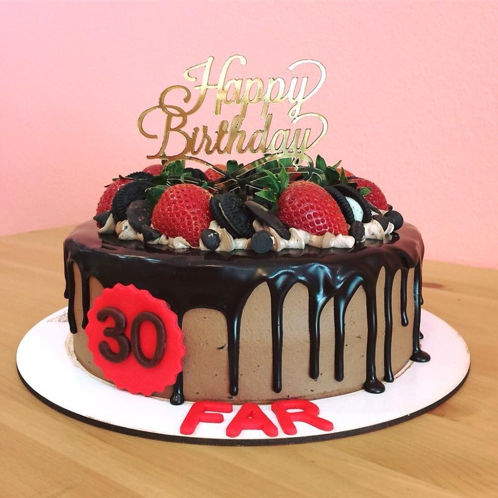 Chocolate strawberry drip birthday cake