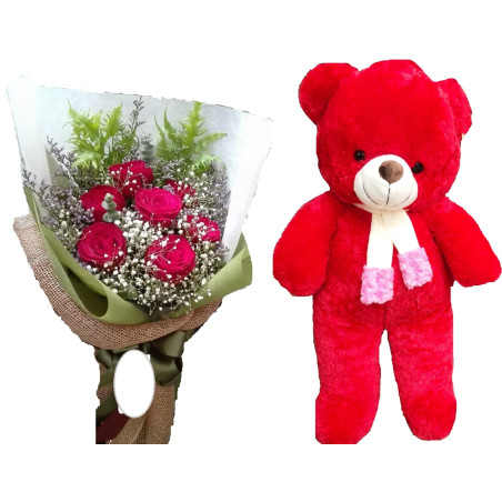 The  teddy bear size 1 meter with flowers