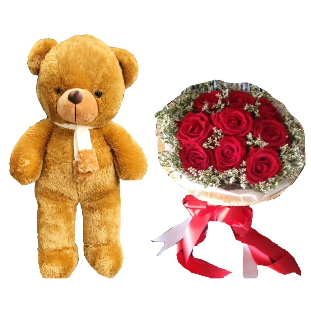Teddy bear and red roses
