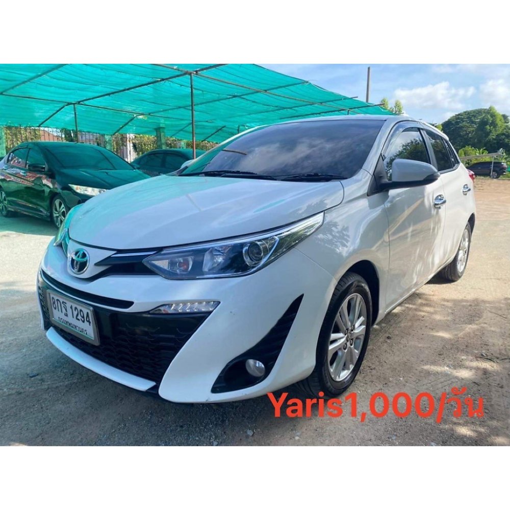 White Toyota Yaris hatchback front