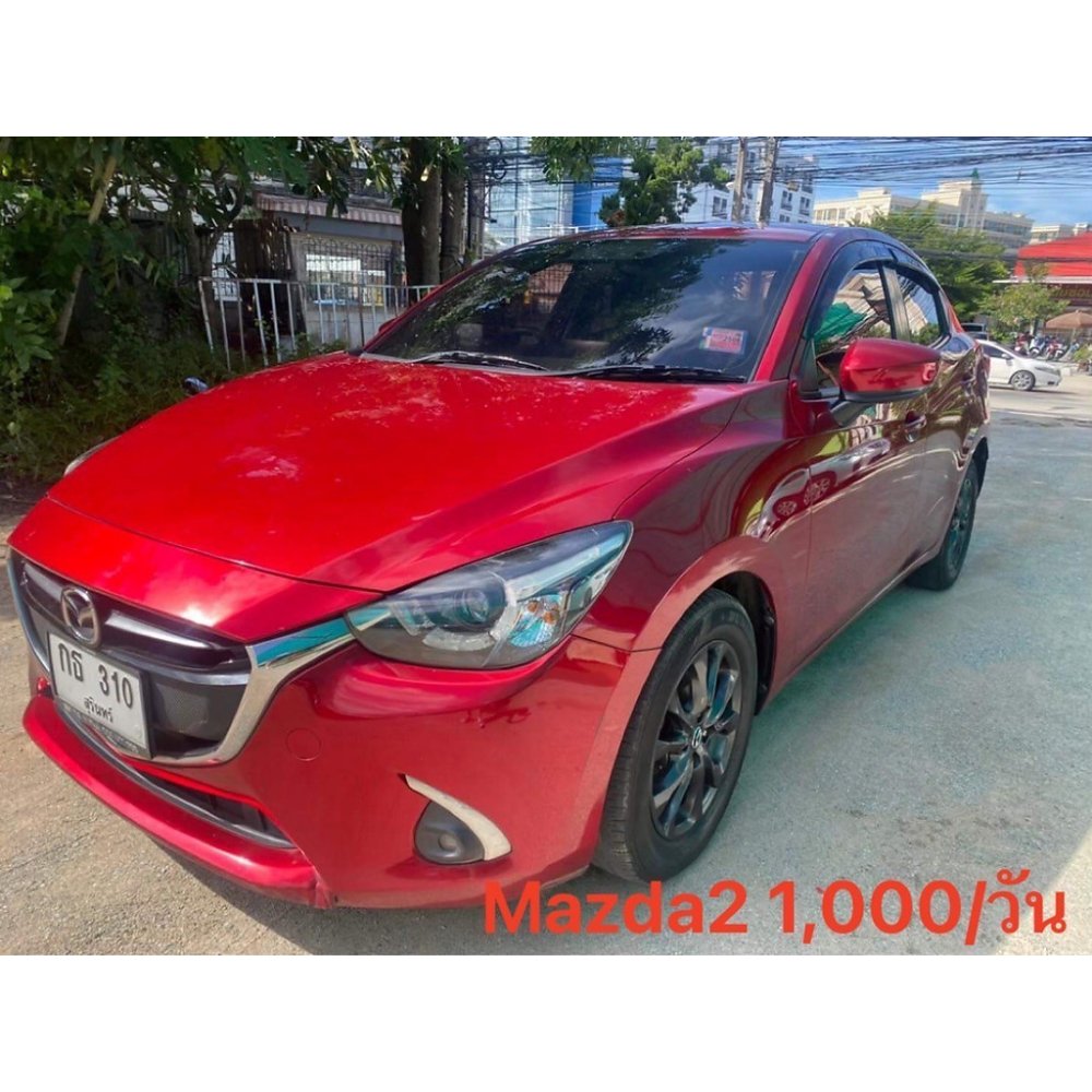 Red Mazda 2 sedan front view