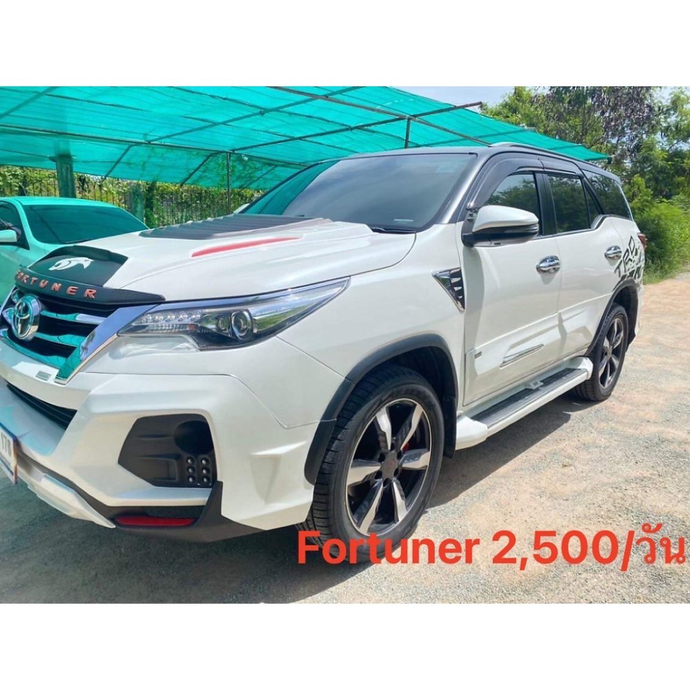 Modified white Toyota Fortuner SUV