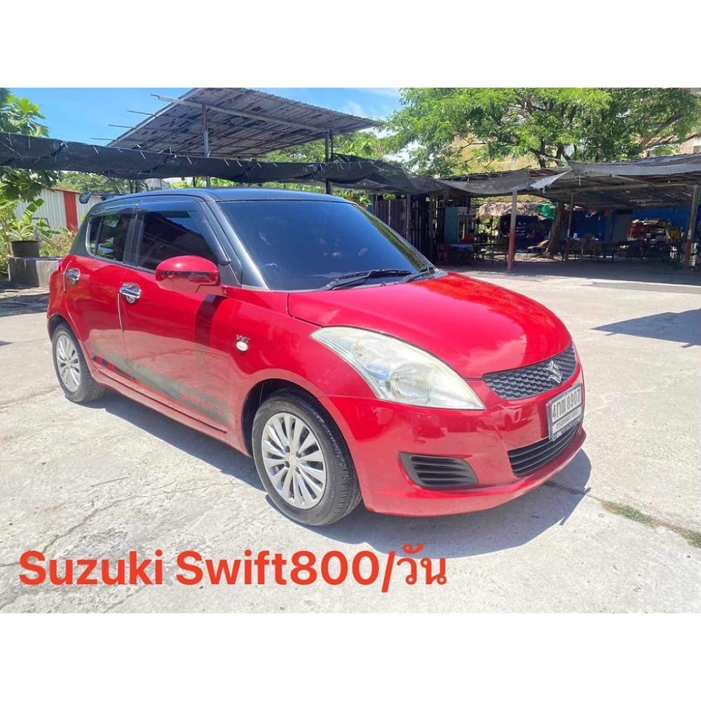 Red Suzuki Swift compact hatchback