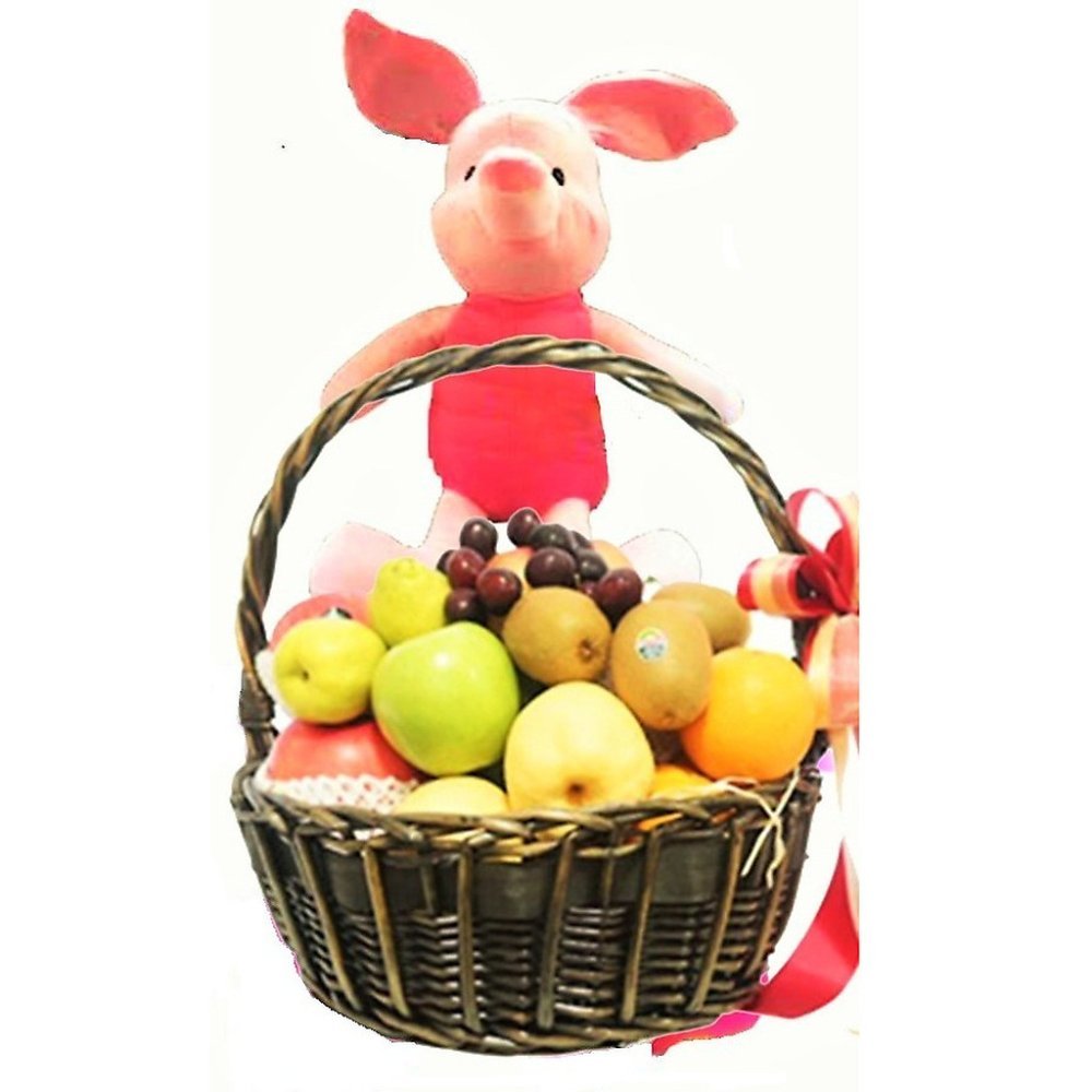 Cesta de fruta con cerdito de peluche