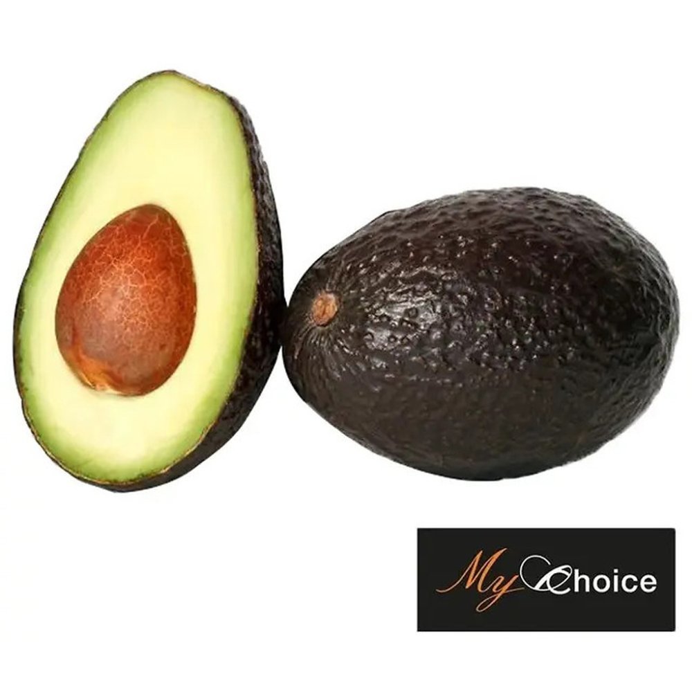 Ripe whole and halved Hass avocado