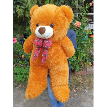 Grand ours en peluche doré