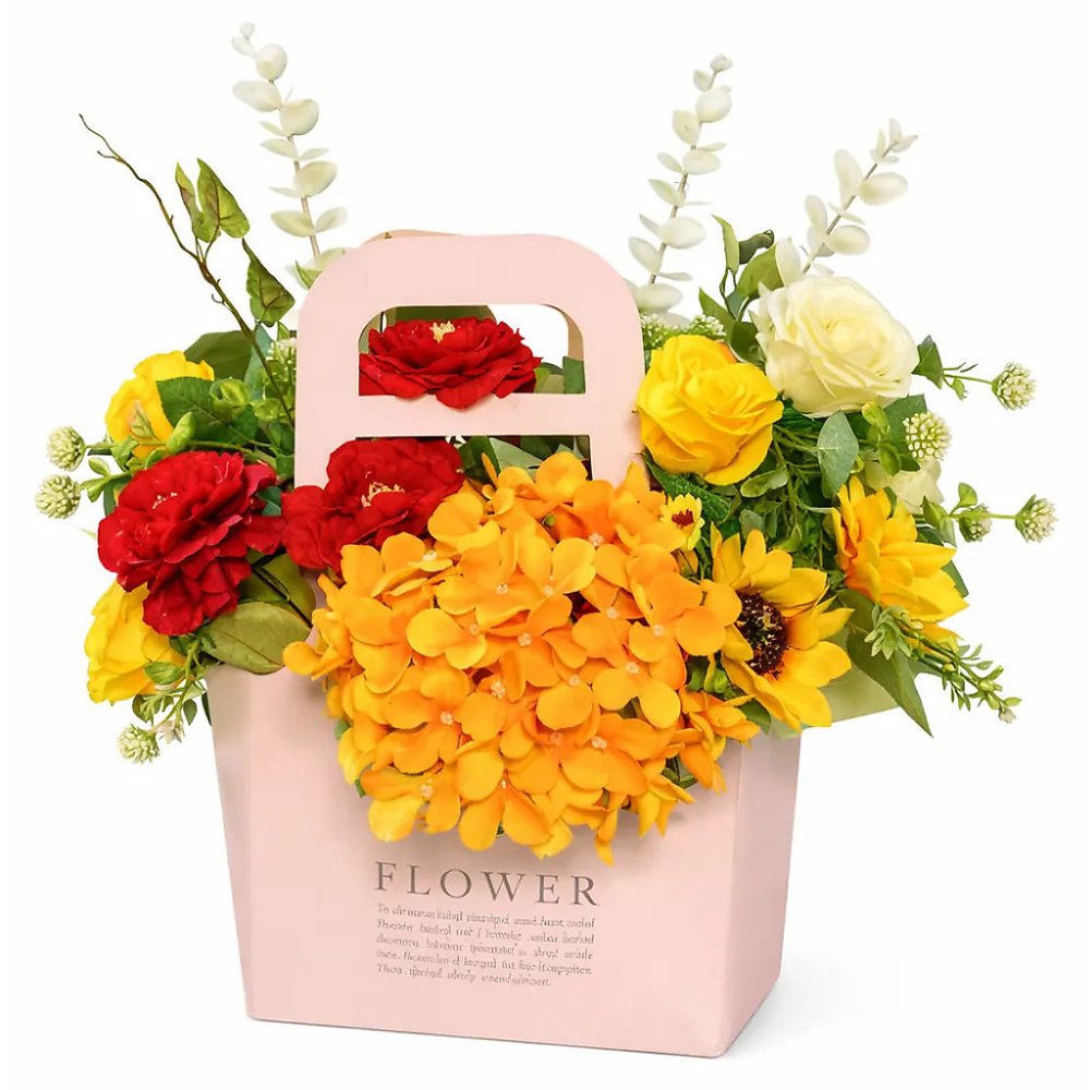 Artificial flowers in pink paper bag