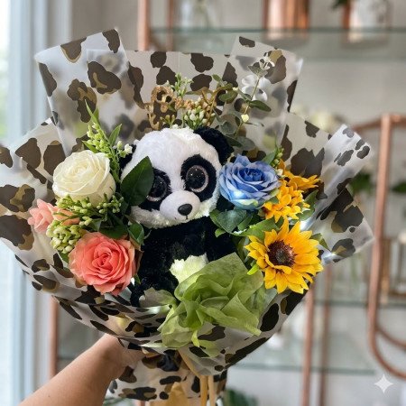 Panda plush and flower bouquet